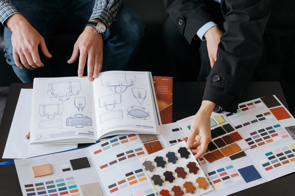 Designers selecting physical colour swatches